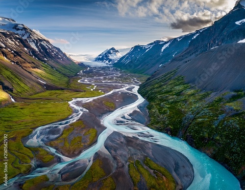aerial view of a river flowing through an arctic valley