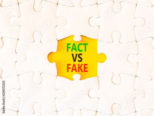 Fotografie Fact vs versus fake words symbol