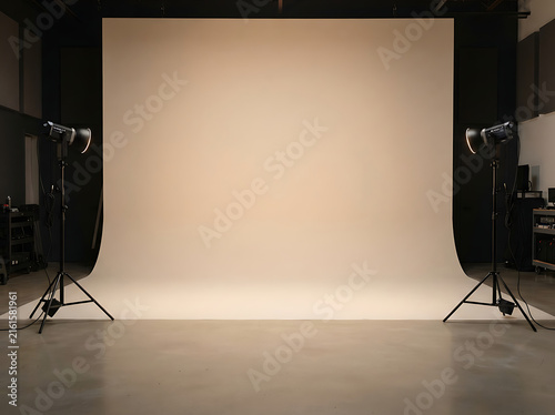 Professional photo studio with white cyclorama wall and studio lighting equipment setup