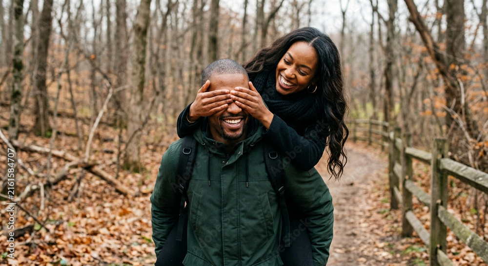 Fototapeta premium Happy African American Couple Piggyback Ride in Autumn Forest