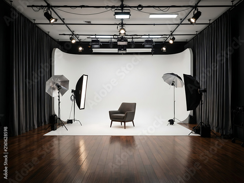 Professional photo studio interior with white cyclorama wall and lighting equipment setup