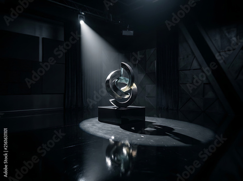 Abstract metallic sculpture illuminated by a dramatic spotlight in a dark gallery setting