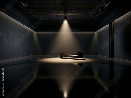 Modern minimalist furniture set in a dark empty studio room with dramatic spotlighting