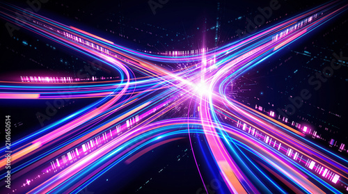 Foto Long exposure light trails of vehicles moving through a city highway intersection at night