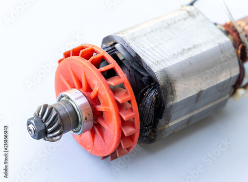 Obraz na płótnie Disassembled electric motor rotor with red fan and gear components