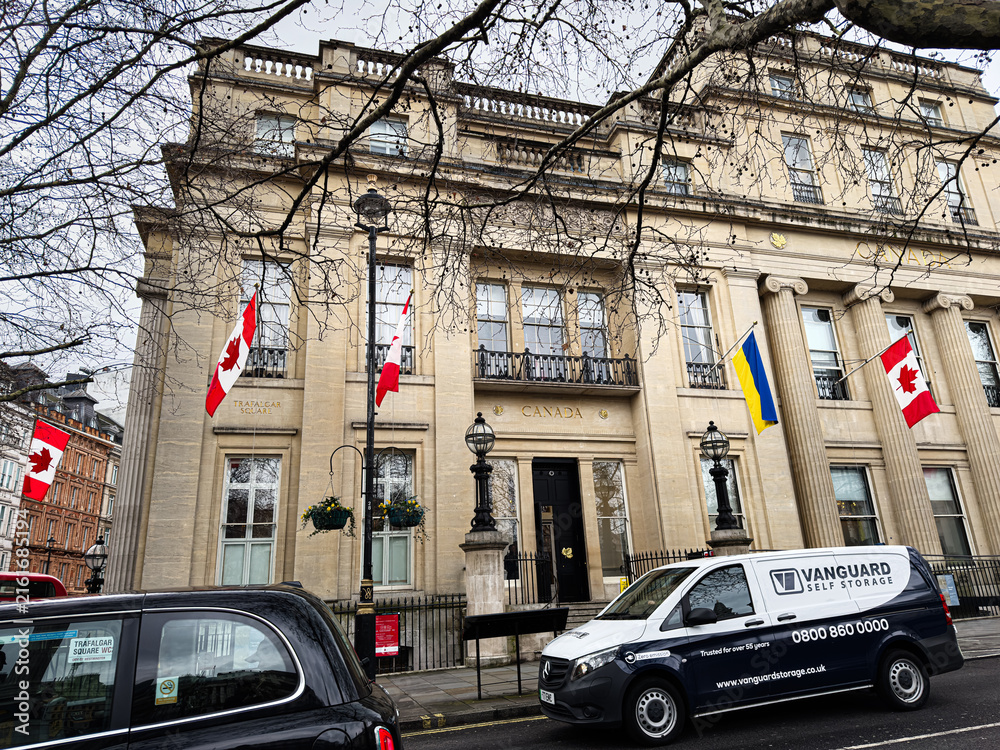 Fototapeta premium Canada High Commission building with flags at Trafalgar Square in London, UK street scene