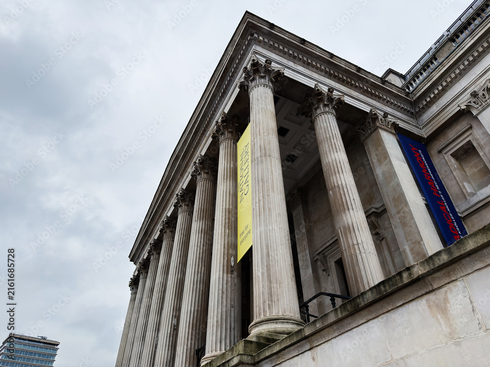 Fototapeta premium Historic neoclassical museum National Gallery facade with Corinthian columns in London, UK against cloudy sky