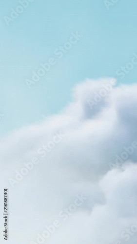 Animation of gray sculpture of woman over blue sky and clouds, copy space