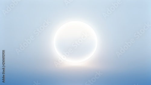 Abstract glowing circular light ring floating in a soft blue misty background.