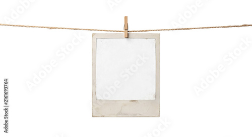 Fotografie Vintage instant photo frame hanging on a twine line with a wooden clothespin