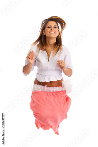 Young woman jumping. Isolated on white background