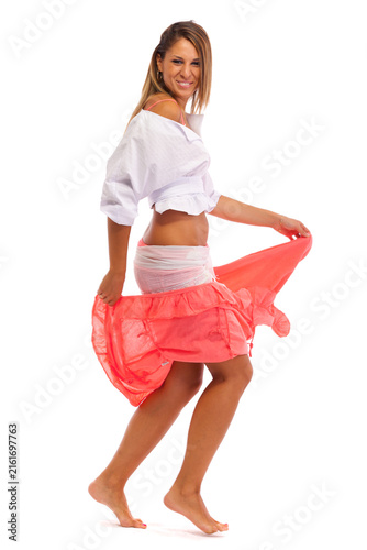 Young woman dancing. Isolated on white background