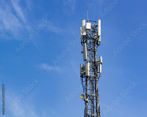 Telecommunication Tower Base Transceiver Station with Antennas Under Blue Sky