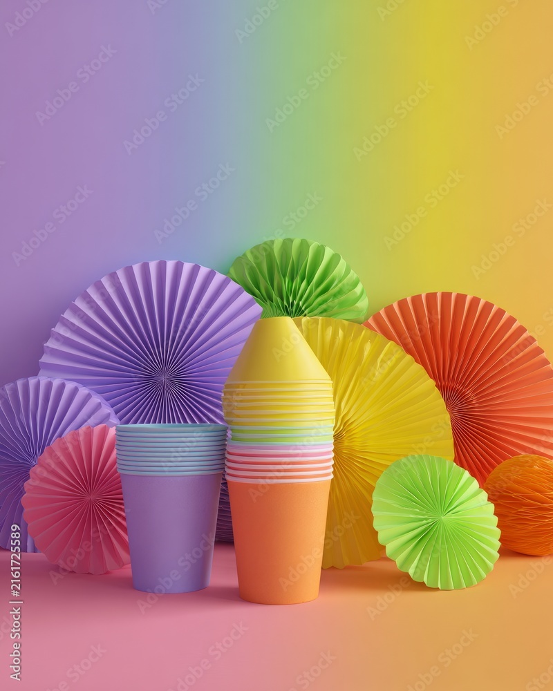 Fototapeta premium Colorful paper cups and rainbow paper fans for party decoration