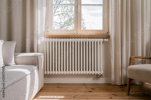 Electric radiator in living room providing warmth during cold days