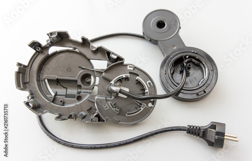 Fotografía Disassembled Appliance Plastic Parts with Power Cord and Plug on White