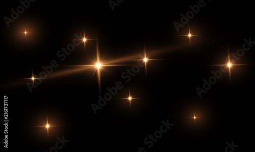 Glowing Golden Star Light Flares Pack with Realistic Lens Glare on Black Background