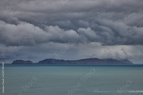 Canvas Print storm clouds roll over San Lorenzo Island as seen from the cliffs of Miraflores, Lima, casting a moody, atmospheric veil over the Pacific coastline