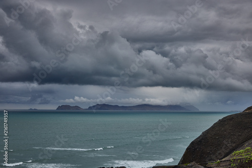 Fotografie storm clouds roll over San Lorenzo Island as seen from the cliffs of Miraflores, Lima, casting a moody, atmospheric veil over the Pacific coastline