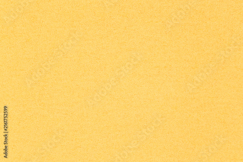 olden yellow backdrop: close up of sheet of craft cardstock with tiny speckles texture