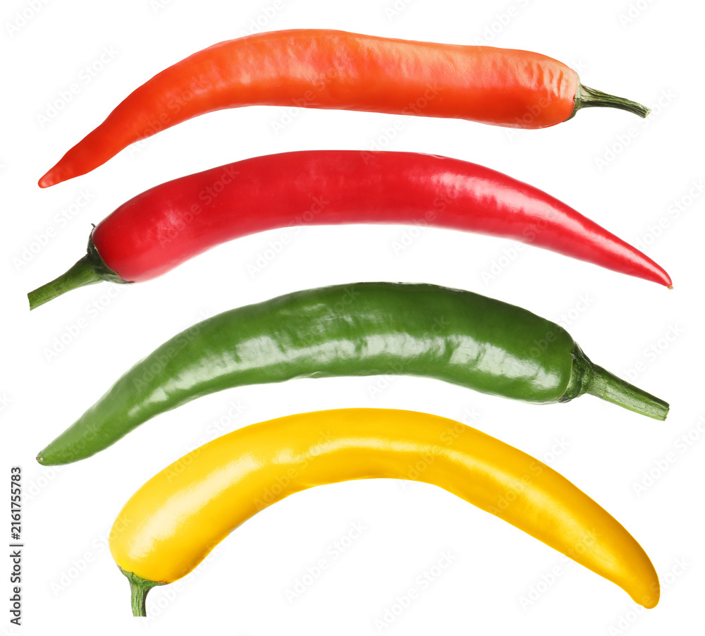 Naklejka premium Chili peppers in different colors isolated on white