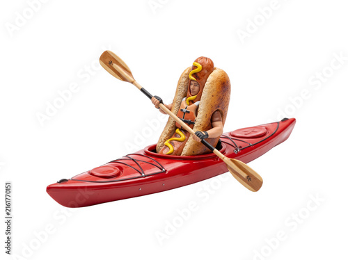 Man hot dog costume kayaking red boat paddling wooden oar, funny fast food sports concept isolated on black background for quirky outdoor adventure, creative summer food humor and unusual activity.