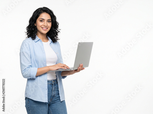 Young Indian woman holding side view laptop for online education study abroad university admission scholarship application international learning and career planning