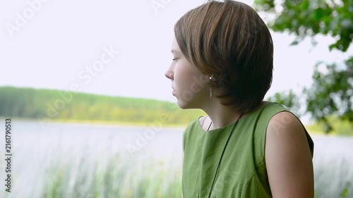 Beautiful calm young Caucasian teenage girl looking at camera.