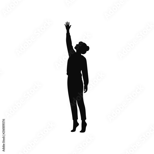 Silhouette of a woman reaching up while standing on her tiptoes