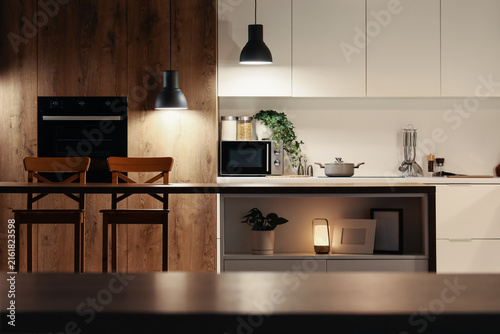 Fotografie Modern kitchen interior design with warm lighting, contemporary home decor and s