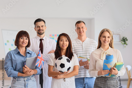 Group of teachers smiling in school office