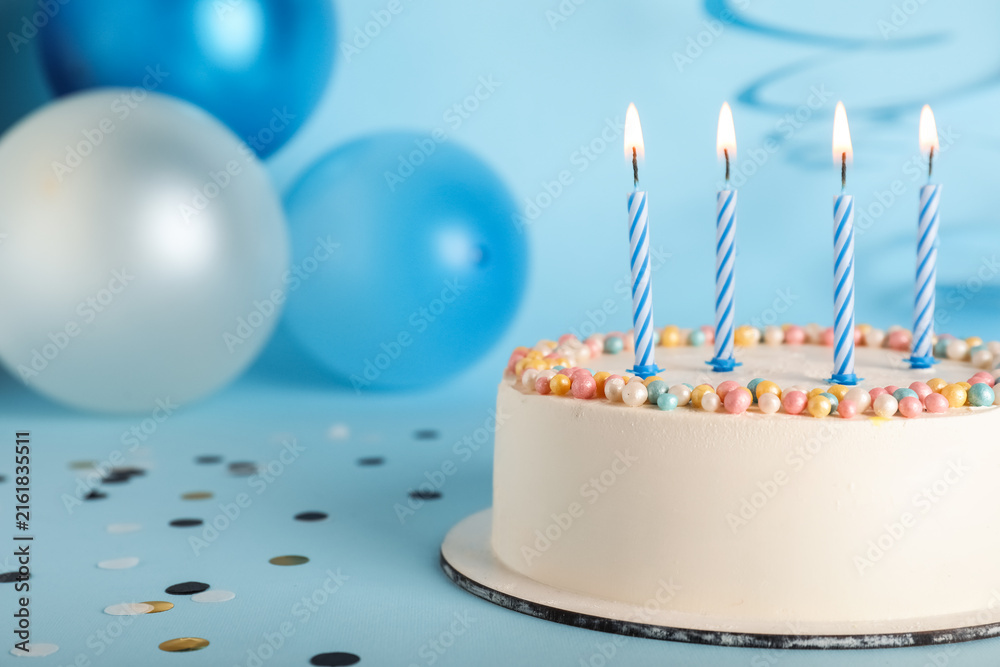 Fototapeta premium Tasty Birthday cake on blue background