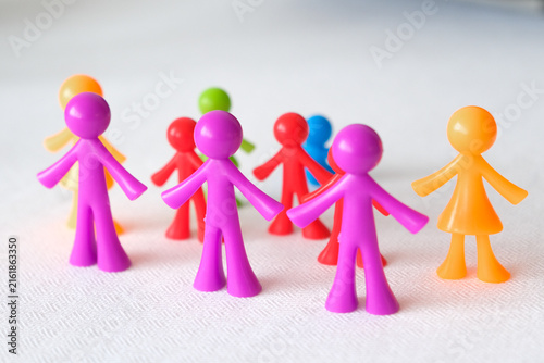 Photography Colorful stick figures standing together representing community