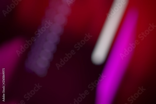 Close-up of neon purple pink and white lights creating an abstract background with vibrant colors