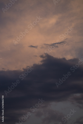 фотографія Moody Twilight Sky with Dark Storm Clouds and Soft Pink Light