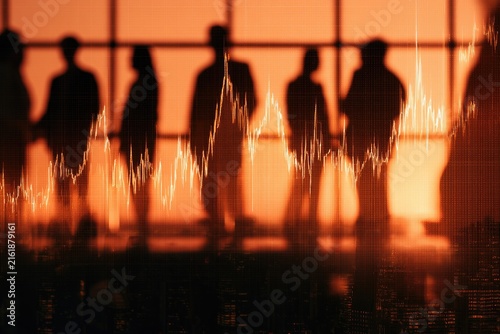 Silhouetted figures stand against a fiery sunset, overlaid with a financial graph