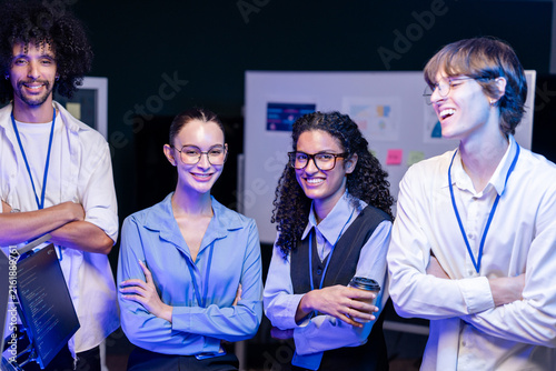 фотографія Candid moment as a diverse, multiethnic software team gather for a confident tea