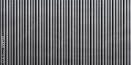 Vertical ribbed metal texture with shadow and light for industrial backgrounds.