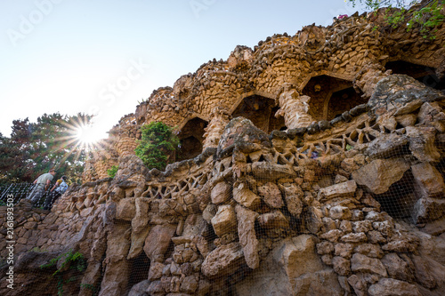 Arcade of Stone Columns Designed by Antoni Gaudi in Park Guell on Sunset in Barcelona, Spain