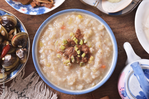 Photography Brown rice porridge served with side dish on the table.