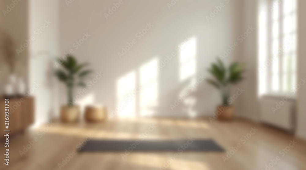 Fototapeta premium Blurry background of bright minimalist yoga studio with mat on wooden floor and plants.