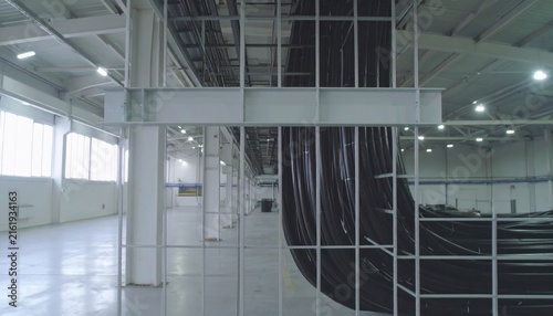 Industrial Facility Interior with Large Bundles of Heavy Electrical Cables and Metal Support Structures