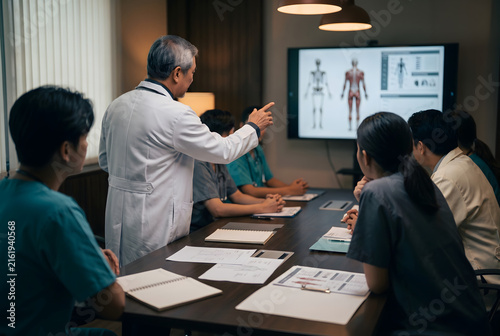 Medical Team Discussing Human Anatomy During Clinical Conference