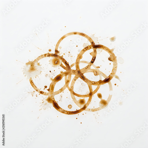 Five golden rings stacked together in a pile