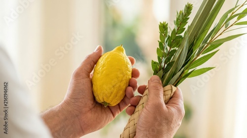 Jewish Man Holding Etrog and Lulav for Sukkot Festival Celebration