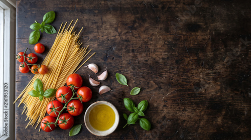 Italian Pasta Ingredients with Spaghetti and Fresh Tomatoes