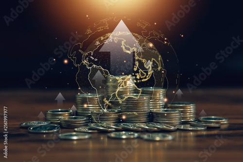 Global finance concept with stacked coins, glowing world map and upward arrows, representing international investment growth, economic expansion, wealth, profit, and market success.