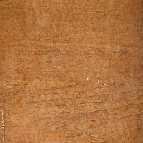 Scratched plywood surface with natural wood grain