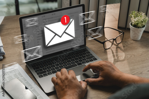 Konstfotografi Hands checking email notification on laptop with floating mail icons, showing new email alert, inbox message update, digital communication, online notification, office workspace