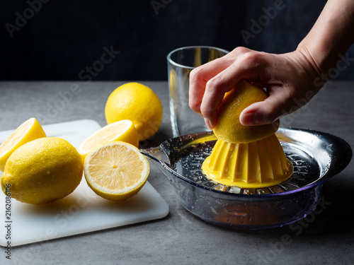 Bild auf Leinwand Juice the lemons with a juicer